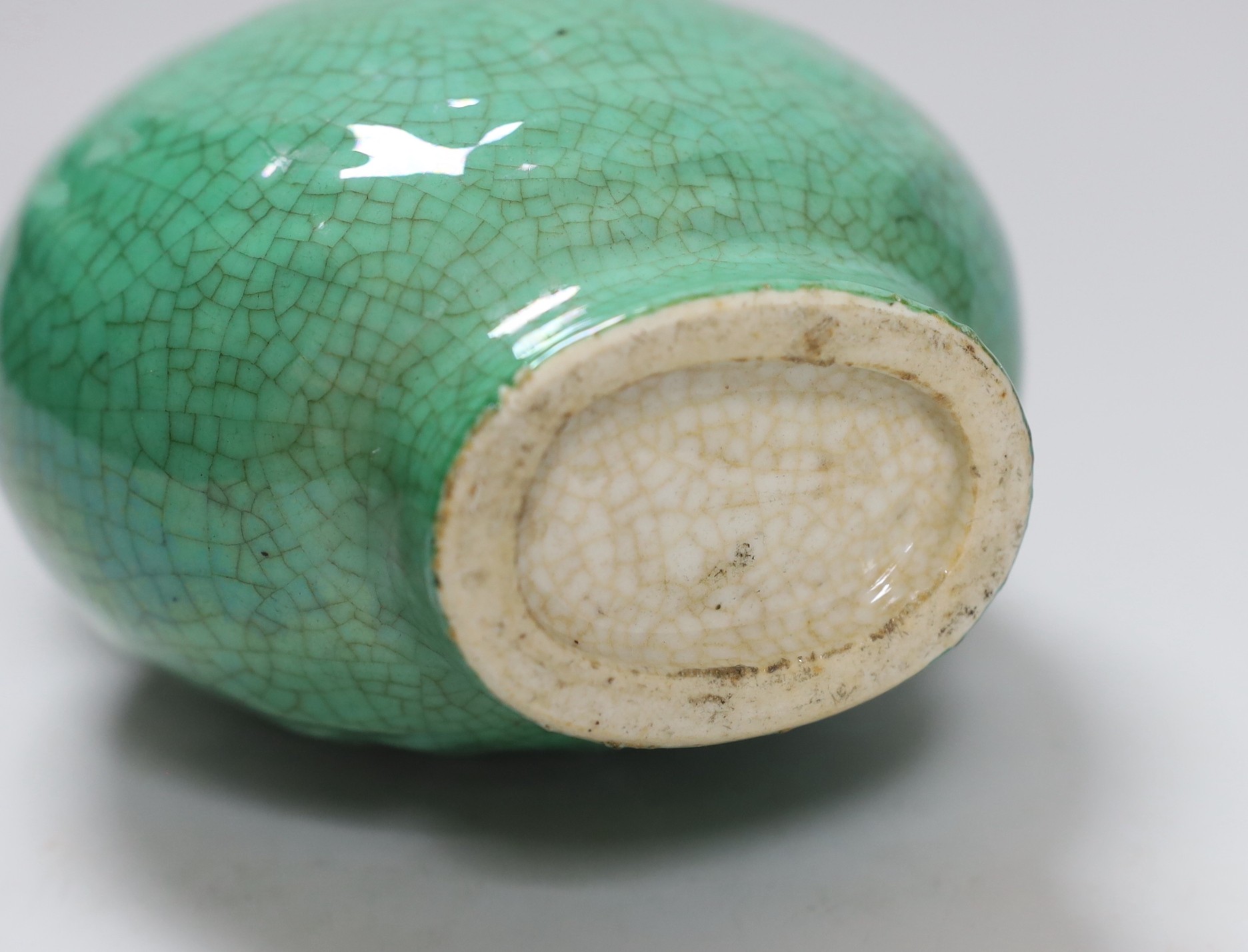 A 19th century Chinese green crackle glaze ‘eight trigrams’ moonflask, 19.5cm